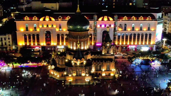 航拍哈尔滨夜景地标圣索菲亚教堂广场上游客
