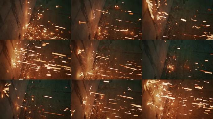 抽象的夜景图像，捕捉到粗糙砖石表面上发光的火花和动态