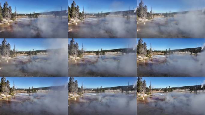 阳光明媚的一天，黄石公园的火洞泉冒着蒸汽