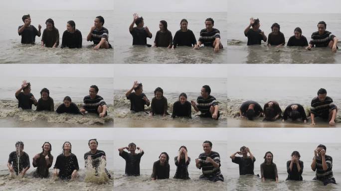 亚洲华人朋友在槟城海滩的雨天嬉戏，溅起海水，头发湿漉漉的。