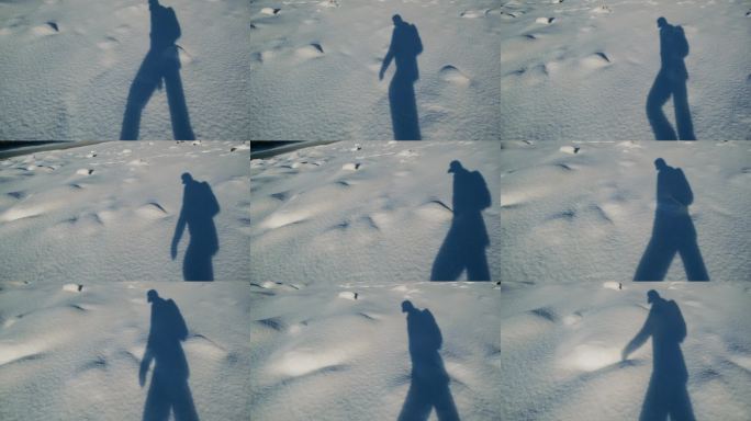 一个冒险的徒步旅行者在寒冷的白天探索雪-covered的风景，背着背包。