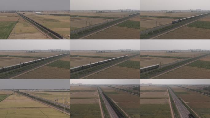 航拍平原田野中的飞驰列车