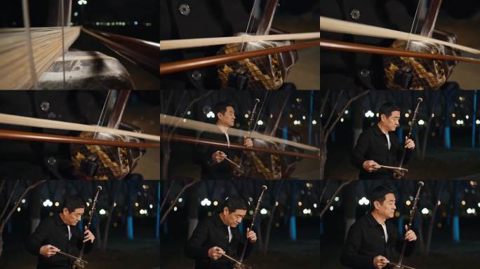 男子拉二胡演奏琴弦特写